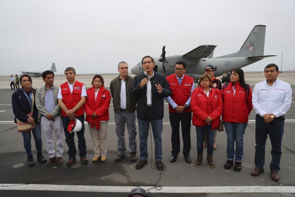 In this photo provided by the Government Palace Press Office, Peru's President Martin Vizcarra, speaks with the press before flight to the destroyed zone for the earthquake in Lima Peru, Sunday, May 26, 2019. A powerful earthquake struck the Amazon jungle in north-central Peru early Sunday, the U.S. Geological survey reported, collapsing buildings and knocking out power to some areas. (Government Palace Press Office via AP)