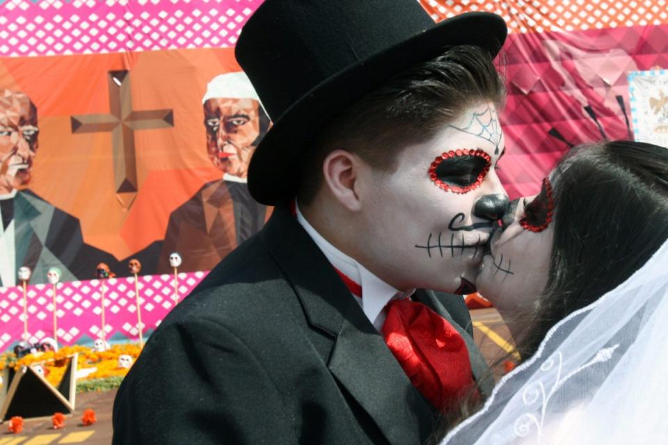 The Day of the Dead is a day of celebration rather than mourning of the dead (Mario Guzman / EPA)