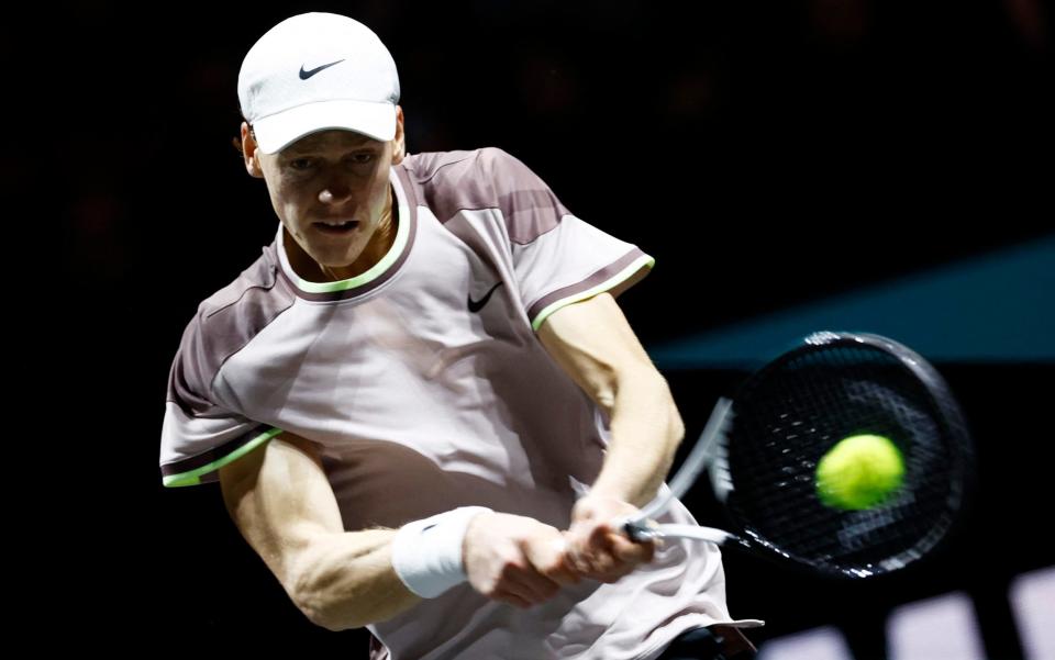 Jannik Sinner lamps a backhand