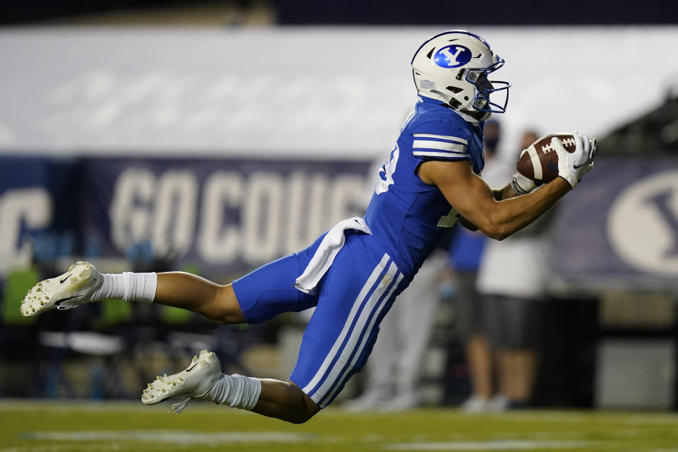 BYU wide receiver Gunner Romney makes a catch during the first half of the team's NCAA college football game against Troy on Saturday, Sept. 26, 2020, in Provo, Utah. (AP Photo/Rick Bowmer, Pool)