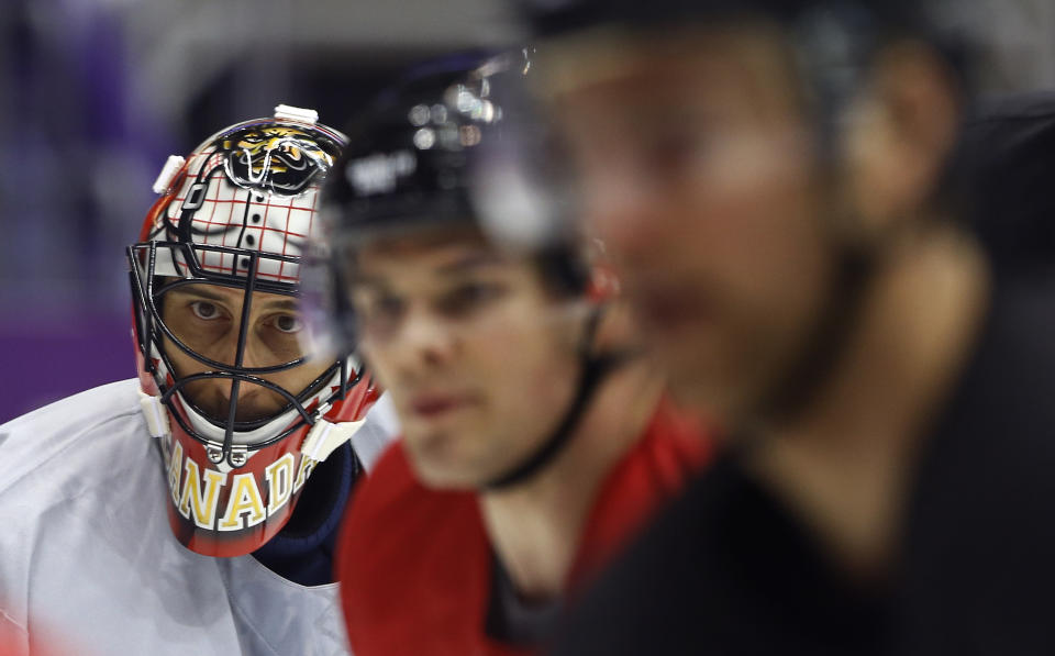 Canada goaltender Roberto Luongo, left, guards the net during a training session at the 2014 Winter Olympics, Monday, Feb. 10, 2014, in Sochi, Russia. (AP Photo/Julie Jacobson)