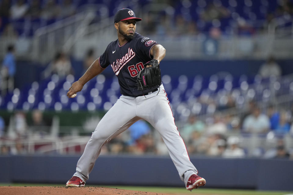 Washington Nationals' Joan Adon delivers a pitch during the first inning of a baseball game against the Miami Marlins, Friday, Aug. 25, 2023, in Miami. (AP Photo/Wilfredo Lee)