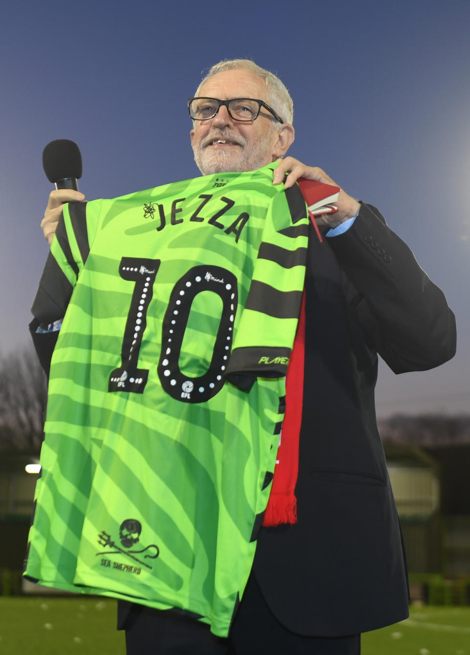 Labour leader Jeremy Corbyn holds a football shirt presented to him at Forest Green Rovers in Nailsworth, Stroud, while on the General Election campaign trail.