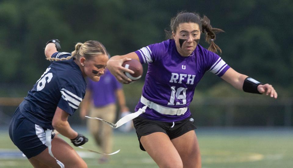 Rumson-Fair Haven quarterback Ella Mason spins away from a defender during the Bulldogs' 26-13 win over Middletown South in the Shore Conference Girls Flag Football League championship game Tuesday night.