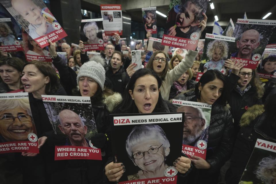 FILE - Medical staff and health professionals attend a demonstration in front of the International Committee of the Red Cross (ICRC) in London on Nov. 9, 2023, calling for an immediate intervention in the case of the hostages kidnapped from Israel on Oct. 7. (AP Photo/Kin Cheung, File）