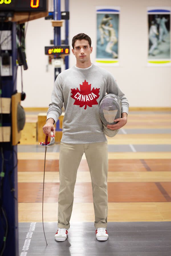 Fencer Philippe Beaudry poses in the new Olympic sweatshirt.