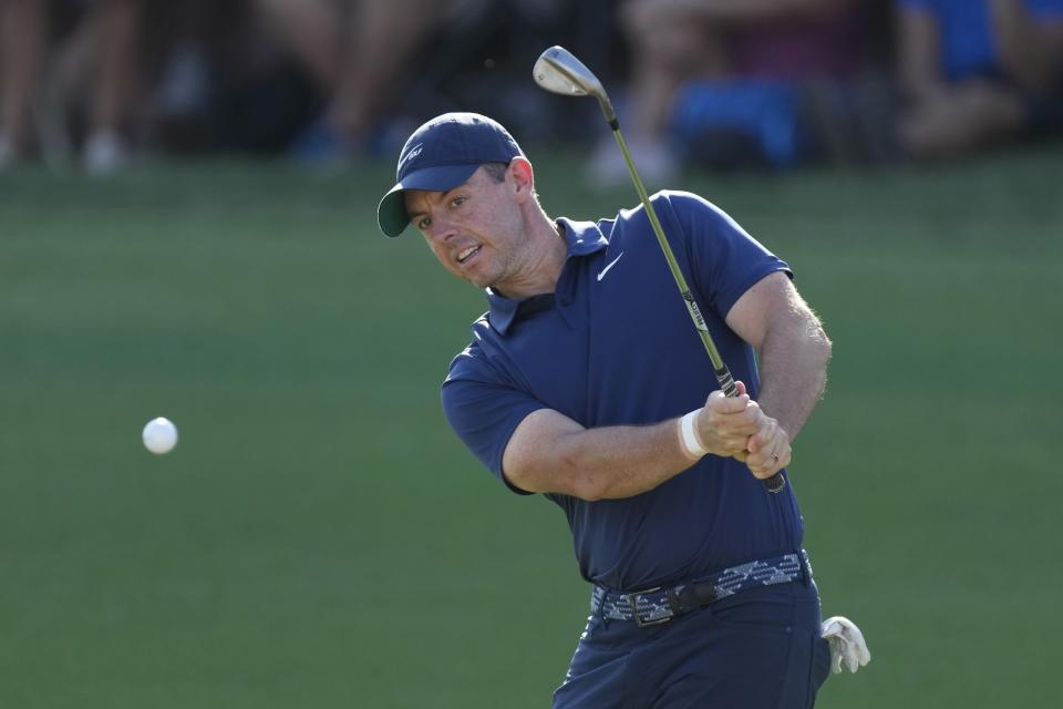 Rory McIlroy of Northern Ireland plays his third shot on the 18th hole during the round two of the DP World Tour Championship golf tournament, in Dubai, United Arab Emirates, Friday, Nov. 17, 2023. (AP Photo/Kamran Jebreili)