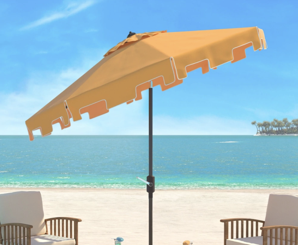 Safavieh UV Resistant Zimmerman 9’ Crank Yellow Market Umbrella (Credit: Overstock)