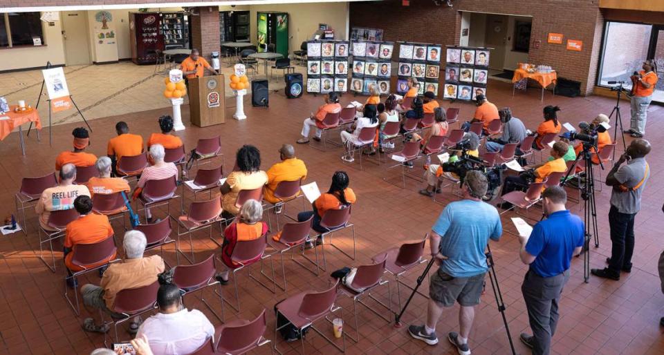 East St. Louis Police Chief Kendall Perry speaks at the National Gun Violence Awareness Day event at the East St. Louis City Hall. Each person wore the color orange. Supporters of the gun violence prevention movement wear orange to symbolize peace because it’s the color hunters wear in the woods to protect themselves and others, according to wearorange.org.