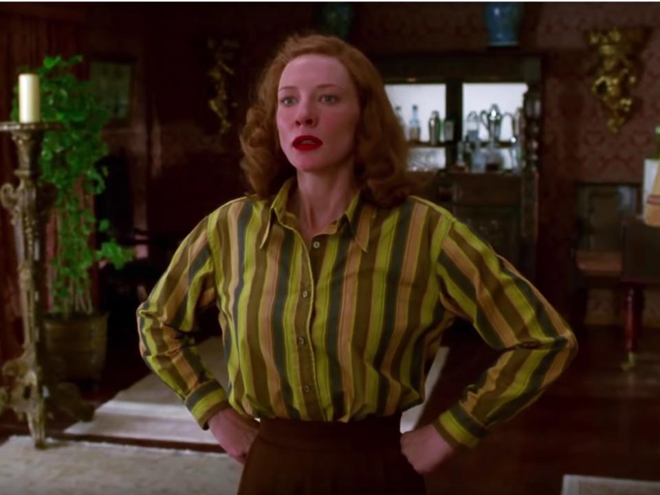 Cate Blanchett as Katharine Hepburn with hands on her hips