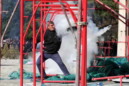 Supporters of the opposition party shout slogans during an anti-government protest in front of the office of Albanian Prime Minister Edi Rama in Tirana, Albania, February 16, 2019. REUTERS/Florion Goga