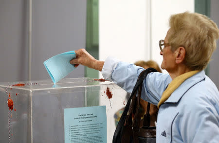 A woman casts a vote at a polling station during the presidential election in Belgrade, Serbia, April 2, 2017. REUTERS/Antonio Bronic