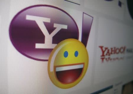 A Yahoo logo is displayed on a monitor in this photo illustration in Encinitas, California, April 16, 2013. Yahoo will report their earnings on Tuesday. REUTERS/Mike Blake