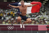 Kevin Mayer, of France, celebrates after his second place finish in the decathlon at the 2020 Summer Olympics, Thursday, Aug. 5, 2021, in Tokyo. (AP Photo/Matthias Schrader)