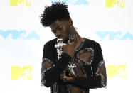 Lil Nas X poses in the press room with the award for best collaboration for "Industry Baby"at the MTV Video Music Awards at the Prudential Center on Sunday, Aug. 28, 2022, in Newark, N.J. (Photo by Evan Agostini/Invision/AP)