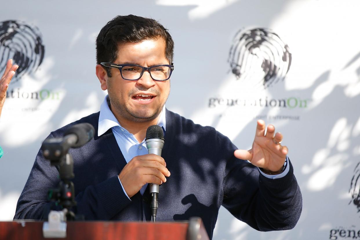 Jimmy Gomez speaks at a generationOn and Hasbro holiday gift distribution event this past December. (Photo: Joe Scarnici/Getty Images for generationOn and Hasbro)