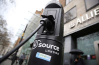 FILE PHOTO - An electric car is plugged into a charging point in London, Britain in this April 7, 2016 file photo. REUTERS/Neil Hall/File Photo