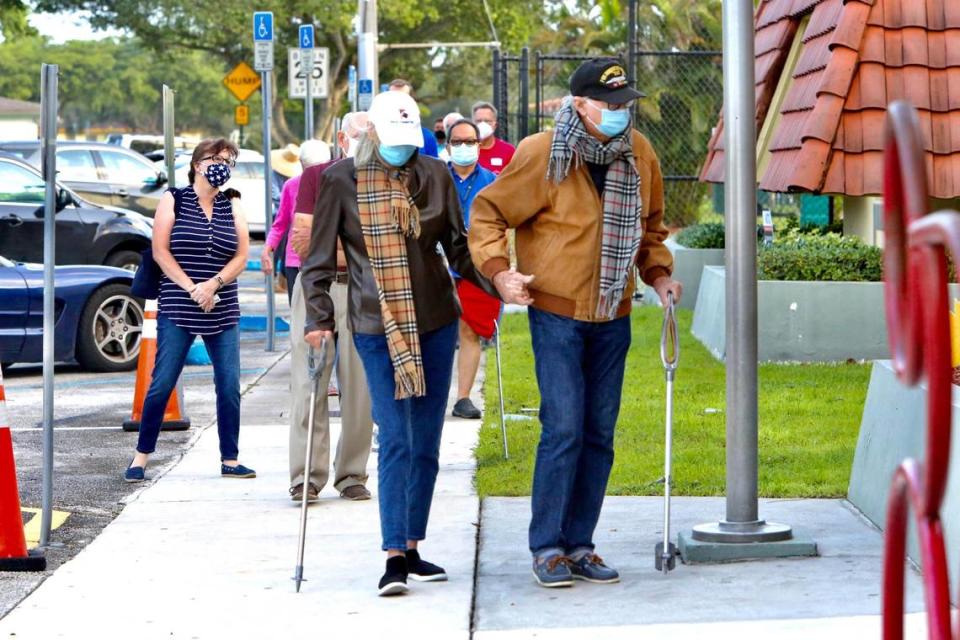 Voters lined up before doors opened Tuesday, Nov. 3, 2020, at the C . Lawton McCall Community Center in Miami Shores.