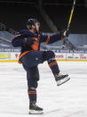 Edmonton Oilers' Connor McDavid (97) celebrates a goal against the Vancouver Canucks during second-period NHL hockey action in Edmonton, Alberta, Thursday, Jan. 14, 2021. (Jason Franson/The Canadian Press via AP)