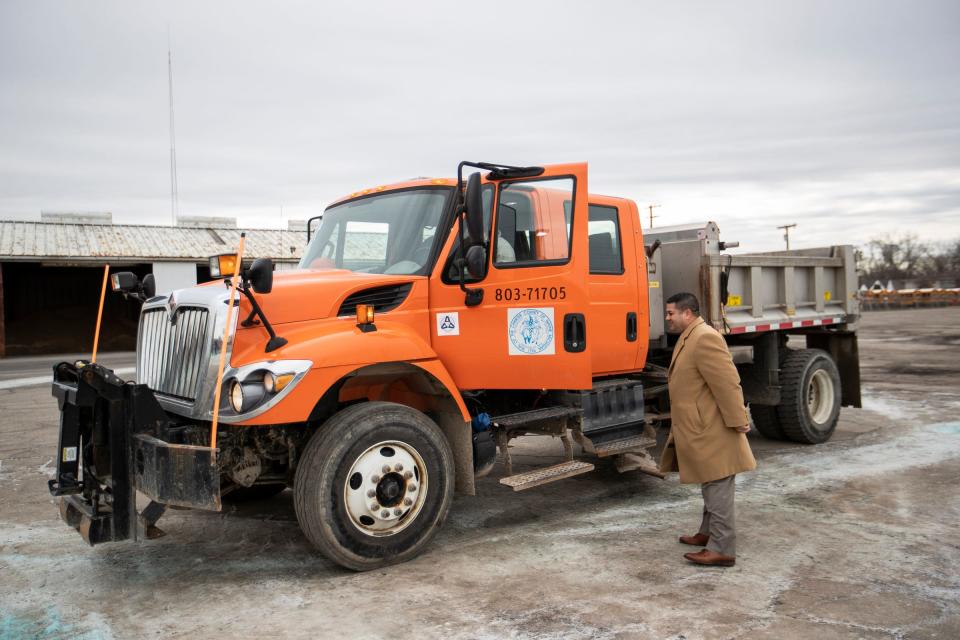 Scott Cabauatan, deputy director of Wayne County Department of Public Services, speaks to a plow truck driver outside of the salt dome at the South Wayne Yard in Wayne on Dec. 14, 2022.