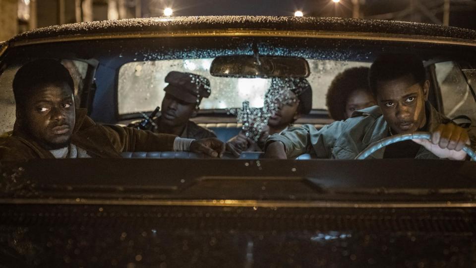 Daniel Kaluuya at left and LaKeith Stanfield behind the wheel of a car in a scene from "Judas and the Black Messiah."