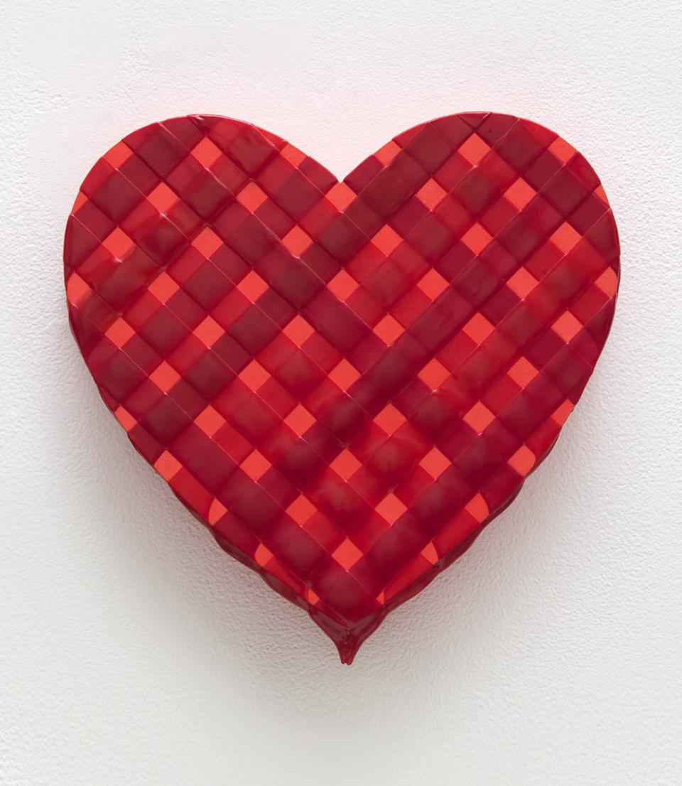 A painting in the form of a heart is layered with woven strips of red paint.