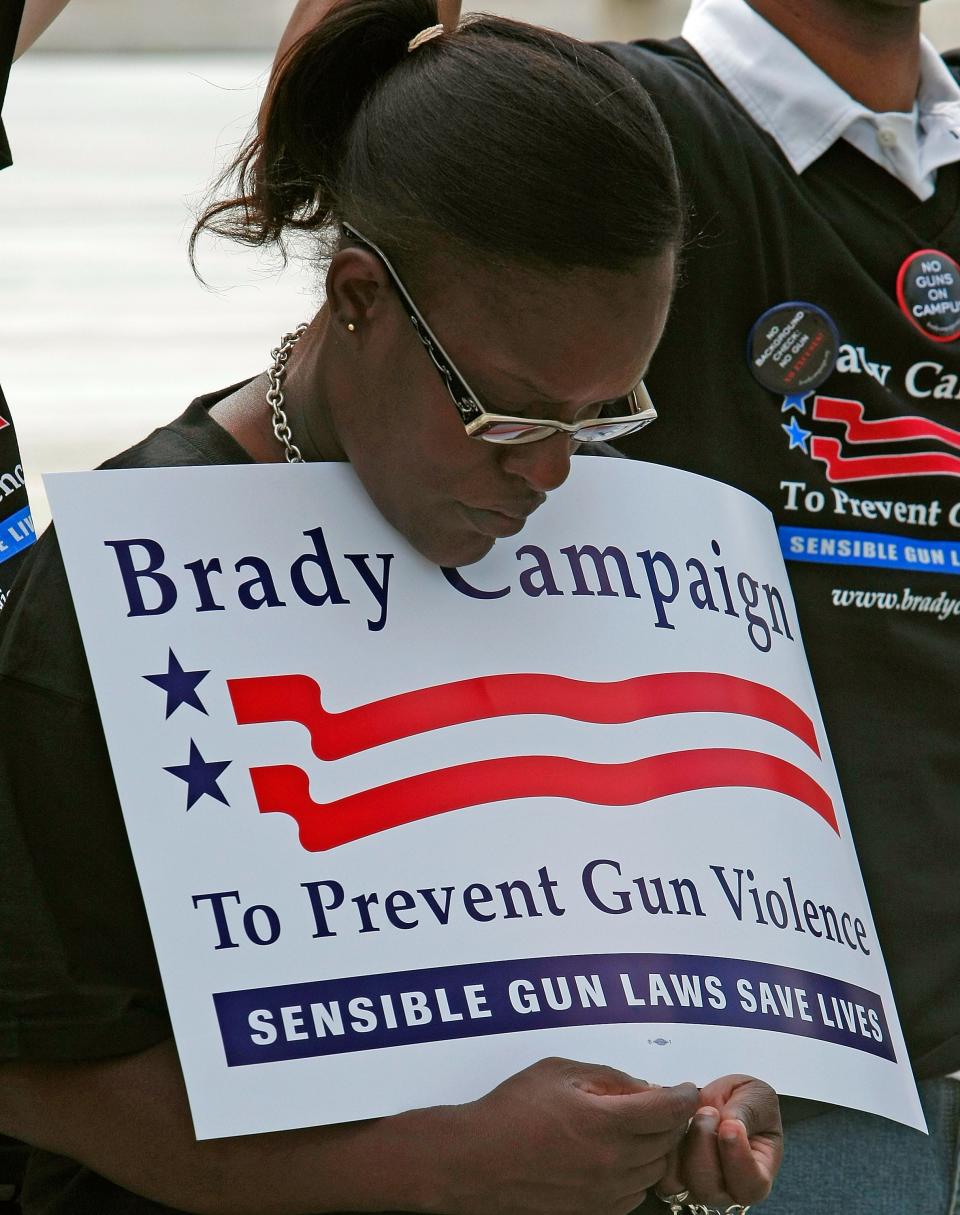 Sabrina Cooper of the Brady Campaign stands in front of the U.S. Supreme Court after a decision on the District of Columbia's gun ban was announced in 2008. The high court struck down the ban and said that Americans have a right to own guns for self defense and hunting,