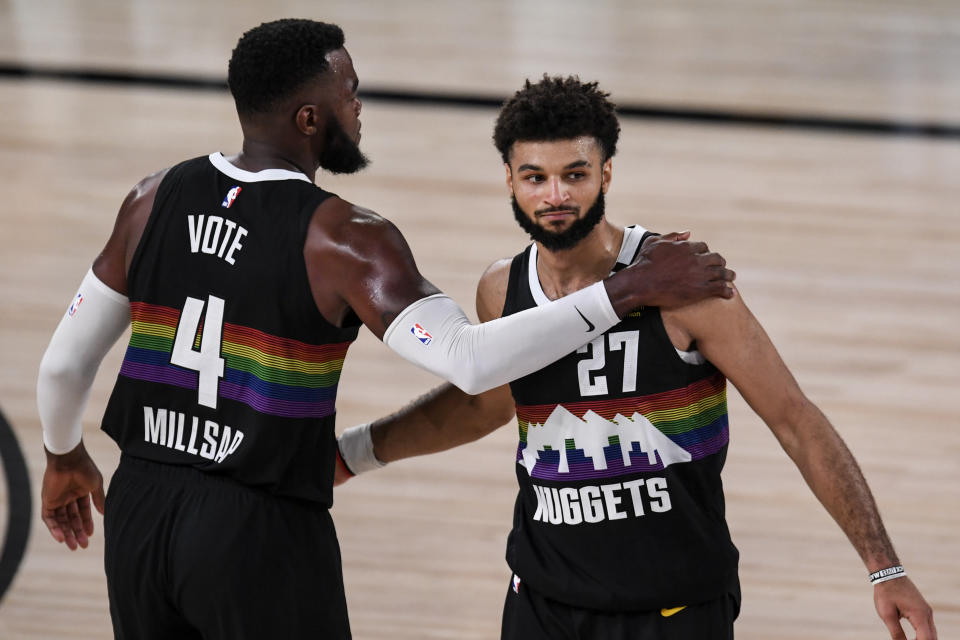 Jamal Murray (27) of the Denver Nuggets and Paul Millsap (4) celebrate a win agains the Los Angeles Lakers during the fourth quarter of Denver's 114-106 win at AdventHealth Arena at ESPN Wide World of Sports Complex in Orlando, Florida on Tuesday, September 22, 2020. (Photo by AAron Ontiveroz/MediaNews Group/The Denver Post via Getty Images)