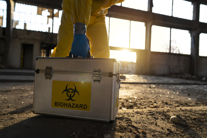 a suitcase with a biohazard sticker on it