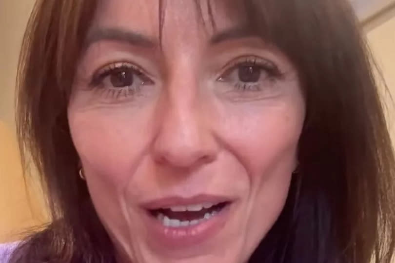 Davina McCall wearing purple in a recent video message to her followers on Instagram