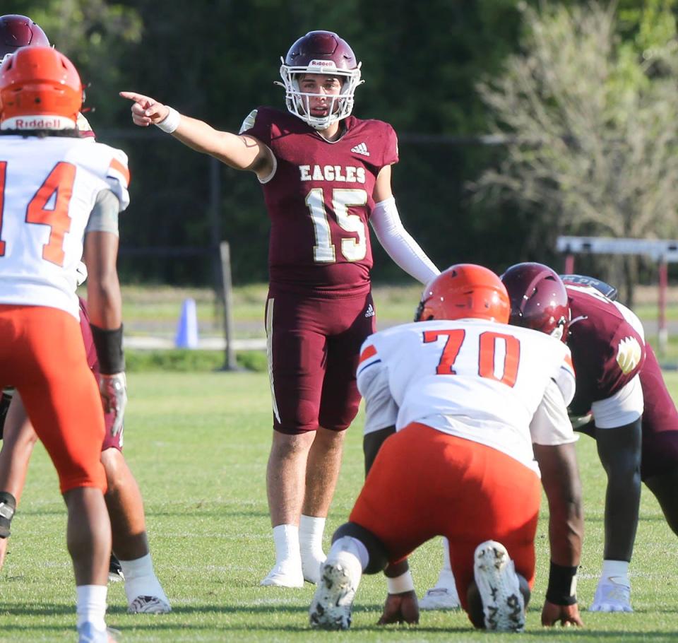QB Kane Lafortune passes points out coverage during a Niceville Escambia spring football scrimmage at Niceville.