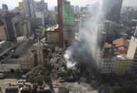 <p>Smoke billows from an abandoned government building occupied by squatters that caught fire and collapsed early the day before, in Sao Paulo, Brazil, Wednesday, May 2, 2018. (Photo: Andre Penner/AP) </p>