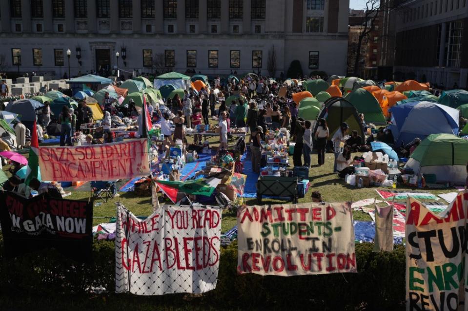 Pro-Palestinian demonstrators gather at an encampment on the lawn of Columbia University on Monday. James Keivom