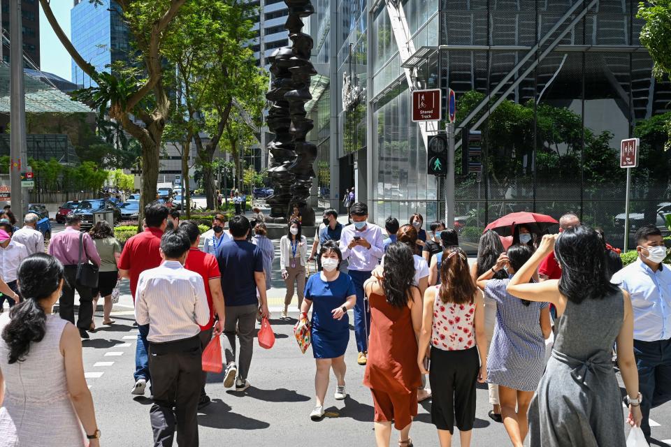Singaporeans in senior finance roles almost double in six years.  (PHOTO: Roslan RAHMAN/AFP) 