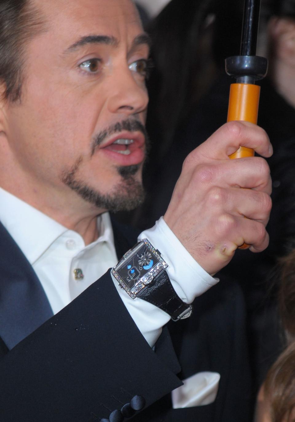 Downey at the 2010 Globes wearing his Harry Winston watch over his sleeve