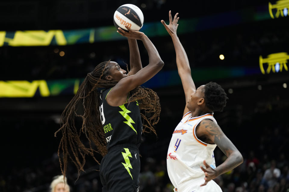 Seattle Storm center Ezi Magbegor, left, shoots against Phoenix Mercury forward Natasha Mack during the first half of a WNBA basketball game Tuesday, June 4, 2024, in Seattle. (AP Photo/Lindsey Wasson)