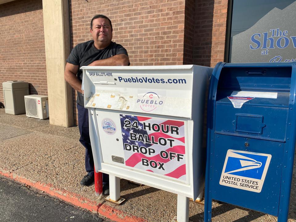 In this file photo, Pueblo County Clerk and Recorder Gilbert "Bo" Ortiz stands in front of one of the county's several 24-hour ballot drop off boxes.
