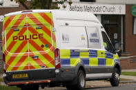 A forensic police van is parked at the site where a member of Parliament was killed on Friday, at the Belfairs Methodist Church, in Leigh-on-Sea, Essex, England, Saturday, Oct. 16, 2021. David Amess, a long-serving member of Parliament was stabbed to death during a meeting with constituents at a church in Leigh-on-Sea on Friday, in what police said was a terrorist incident. A 25-year-old British man is in custody. (AP Photo/Alberto Pezzali)