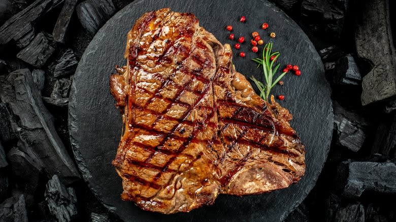 Porterhouse steak against charcoal background