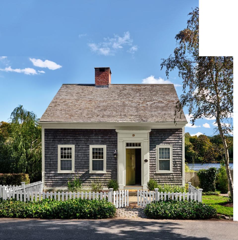 1639 cedar shake cottage with white fence in cape cod, massachusetts