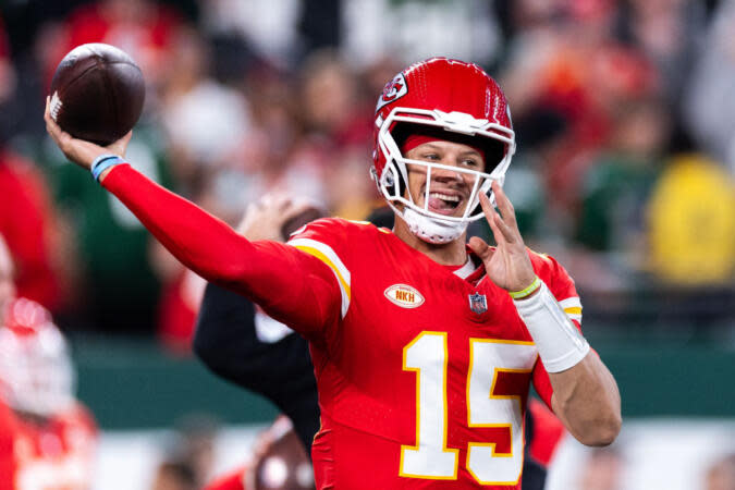 Pictured: Patrick Mahomes throwing the football in an NFL game. Who are the star-studded parents? Find out here. | 