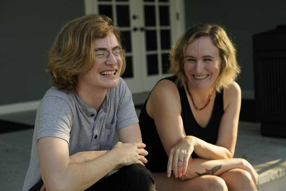 Ray Walker, 17, left, and his mother Katie Rives, share a laugh as they discuss his moving to Virginia for continued gender-affirming care, Wednesday, June 28, 2023, in Madison County, Miss. This year, Republican Gov. Tate Reeves signed legislation banning gender-affirming care for anyone younger than 18. (AP Photo/Rogelio V. Solis)