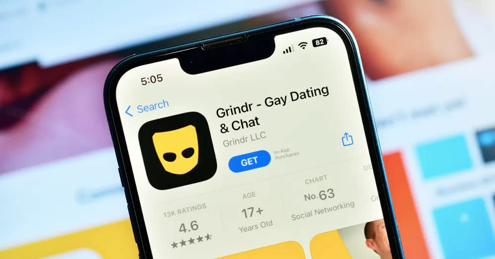 A phone showing the app Grindr, which recently launched an HIV testing service, on the screen.