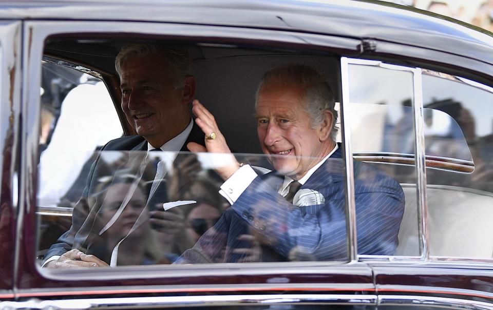 King Charles III waves to well-wishers outside Buckingham Palace, London, following the death of Queen Elizabeth II on Thursday. Picture date: Sunday September 11, 2022. (Photo by Beresford Hodge/PA Images via Getty Images)