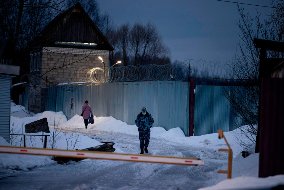 An officer of the Russian Federal Penitentiary Service walks near the gate of the penal colony N2, where the Kremlin critic has been transferred to serve out a prison term, in the town of Pokrov on March 1, 2021.<span class="copyright">Dimitar Dilkoff—AFP/Getty Images</span>