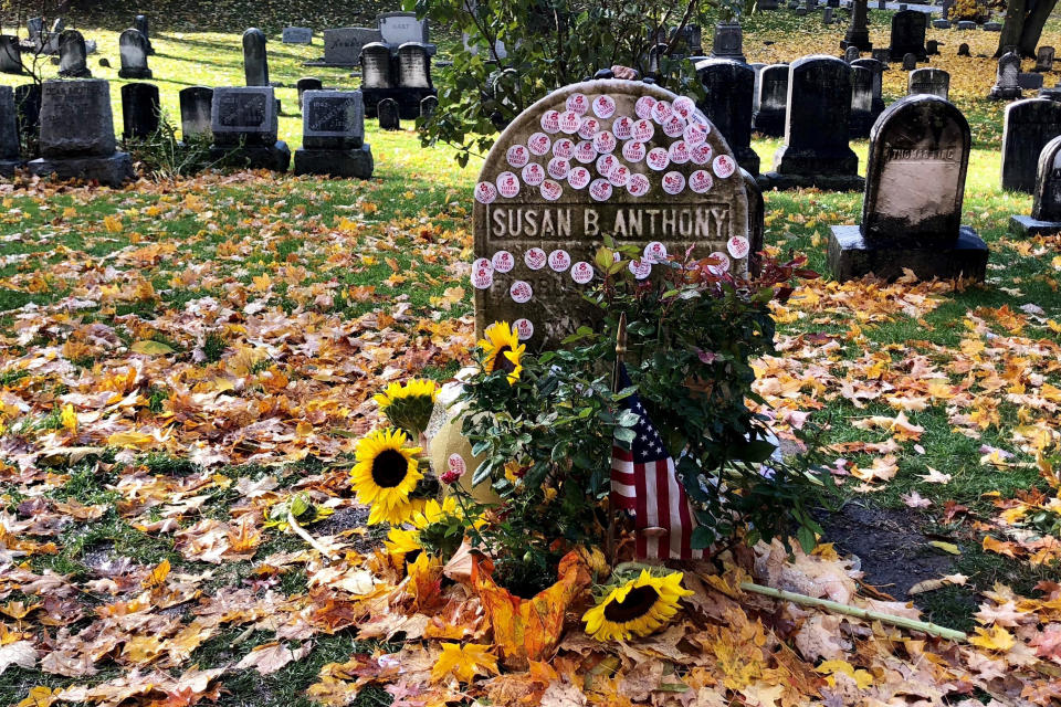 This photo provided by Jessica Crane shows Susan B. Anthony’s grave decorated with ‘I Voted’ stickers in Rochester, N.Y., Tuesday, Nov. 6, 2018. Voters showed up by the dozens to put their “I Voted” stickers on the headstone, an Election Day ritual that pays homage to the voting rights pioneer. (Jessica Crane via AP)
