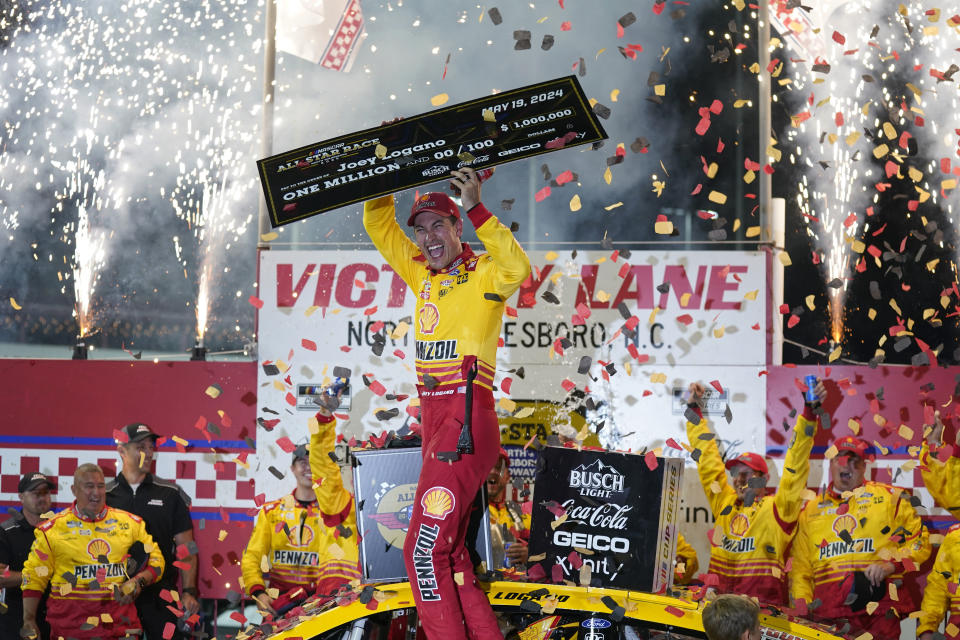 Joey Logano celebrates in Victory Lane after winning the NASCAR All-Star auto race at North Wilkesboro Speedway in North Wilkesboro, N.C., Sunday, May 19, 2024. (AP Photo/Chuck Burton)