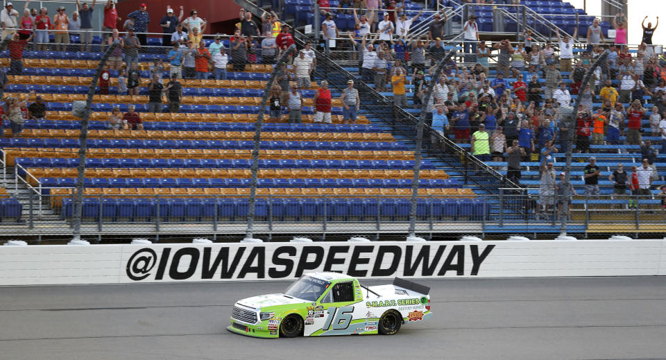 Brett Moffitt races to the finish line while winning the NASCAR Truck Series auto race, Saturday, June 16, 2018, at Iowa Speedway in Newton, Iowa. (AP Photo/Charlie Neibergall)