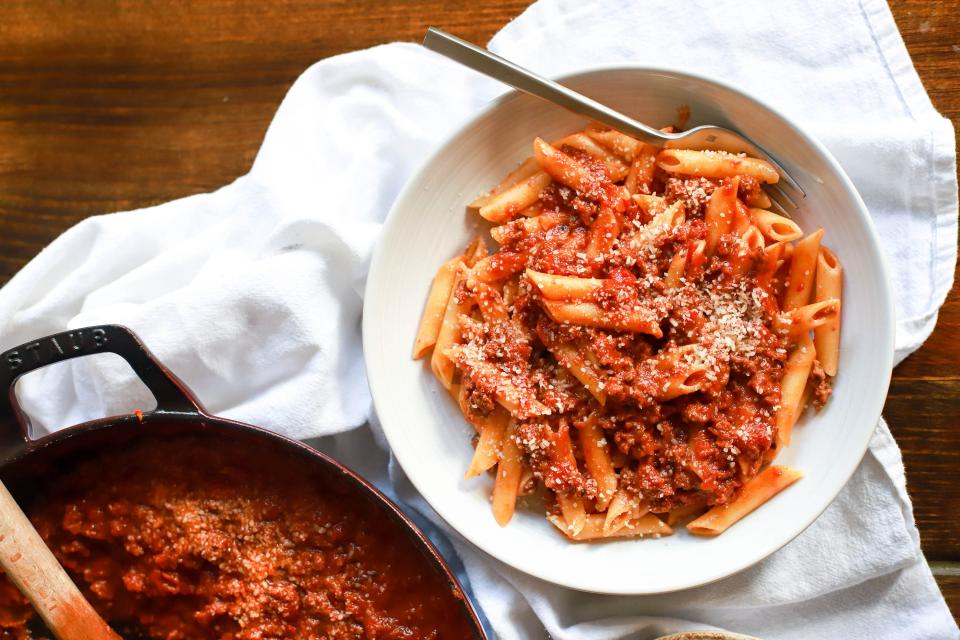 Meat sauce over pasta noodles. 