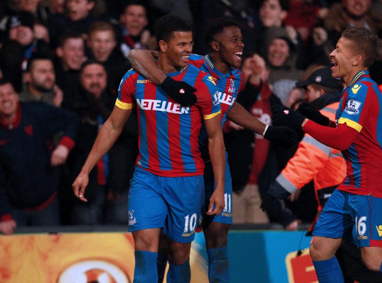 Crystal Palace's Fraizer Campbell (L) celebrates with teammate Wilfried Zaha during their Premier League match against Newcastle United at Selhurst Park on February 11, 2015